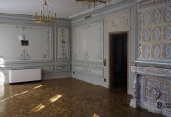 The living room is decorated with alfrey painting and a stove decorated with tiles Living room with decorative stove with tiles