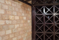 The wine cellar maintains a predetermined temperature for various drinks; special equipment is hidden behind the mirror panels Wine cellar with mirrored panels for equipment