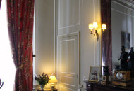 Stucco molding brings variety and elegance to strict interior decoration Stucco molding in the interior of the living room in gray tones