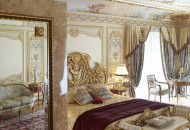 The interior was decorated with painting, gilded stucco molding, stylized furniture and lamps. Painted bedroom in the Baroque style with gilding