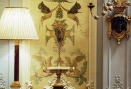 Elegant, light painting decorated the walls of the living room. Animalistic grotesque in monochrome tones gave the room an exclusive decor Painting in the style of animalistic grotesque in the interior of the living room