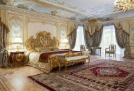The bedroom, decorated in the Baroque style, has combined all the decorative elements of the style: gilding stucco moldings, painted ceilings, ornate furniture Baroque bedroom with large bed