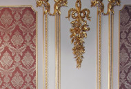Fragment of an architectural mirror with a flower festoon Gold plated mirrors with scallop