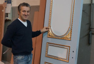 Gilding a wooden door in production