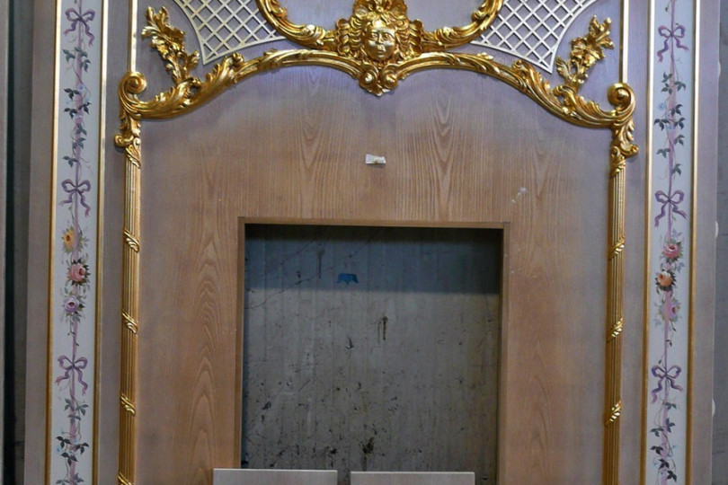 Fragment of boiserie with gilding and alfrey painting