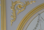 Wide frieze with gilded gold leaf modions Plaster frieze with gold leaf