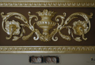 Fragment of a plaster stucco ceiling element Varnishing of the stucco surface before gilding