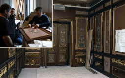 Artists scrupulously make sketches of wall painting in a classic interior, which ultimately helps to create antique interiors
