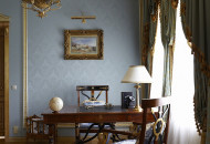 A light, cold tone was chosen for the office, this made it possible to visually change the size of the room Empire style cabinet in blue