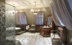 Large bathroom in the attic with marble podium and walls, gilded stucco Luxurious bathroom with gilded stucco