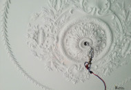 Ceiling decoration with stucco decoration with an overhead rosette in a floral style stucco ceiling decoration with an overhead rosette