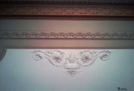 Combined plaster molding on the ceiling in a stylish interior wall decoration with stucco