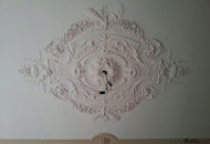 Ceiling decoration with classic plaster stucco molding with a light pattern stucco plaster ceiling