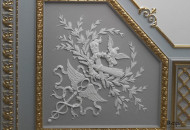 Combined plaster molding on the ceiling in a stylish interior plaster molding on the ceiling