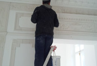 Professional installation of stucco decoration on the wall in a classic interior motange stucco decoration on the wall
