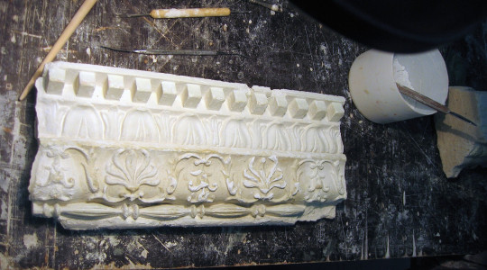 Fragment of the destroyed molding cornice before restoration molding cornice before restoration