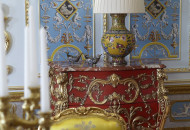 In the dining room, an unusual layout of parquet and ceiling decor created a coherent richly decorated interior Baroque dining room with gilded stucco and decorative parquet