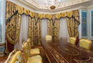 In the dining room, an unusual layout of parquet and ceiling decor created a coherent richly decorated interior Baroque dining room with gilded stucco and decorative parquet